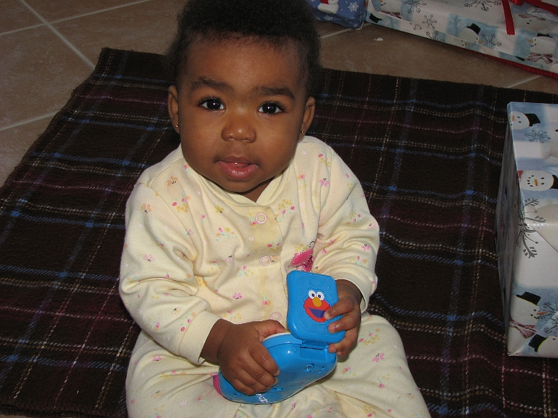 Xmas_2008_025.JPG - Oh, it's an Elmo cellphone! Thank you!