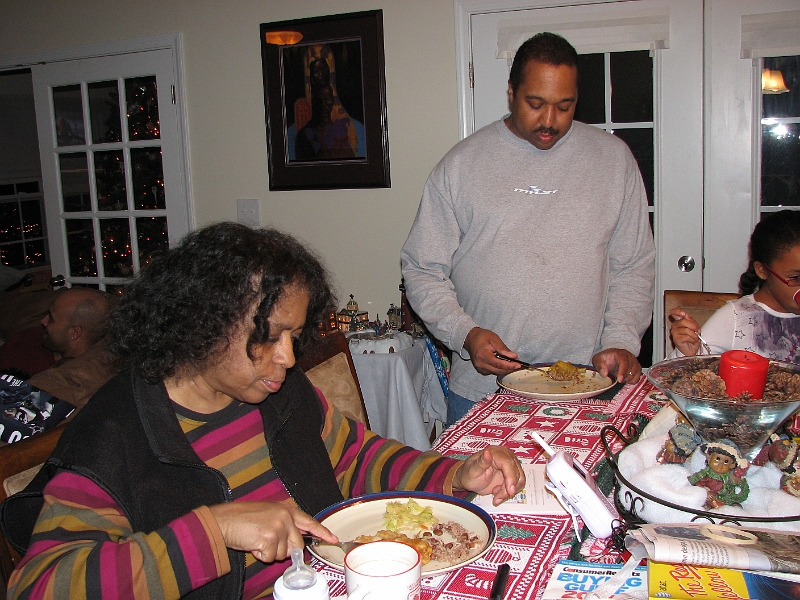 Xmas_2008_247.JPG - Kelsey's daddy and grandma (aka Kyle and Carol for the grown-ups) sitting down to some good eats!