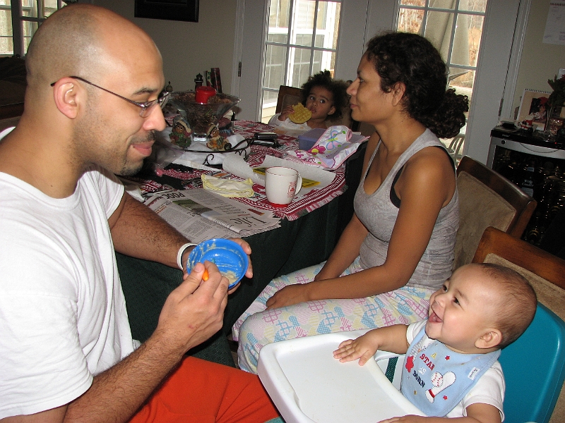 Xmas_2008_258.JPG - Who doesn't enjoy being fed by their Daddy.  This is the last shot taken in NC.  Kim, Mikayla and I jet back home for our own Christmas holiday. Thanks everyone for the Clarke Christmas Experience!!!!