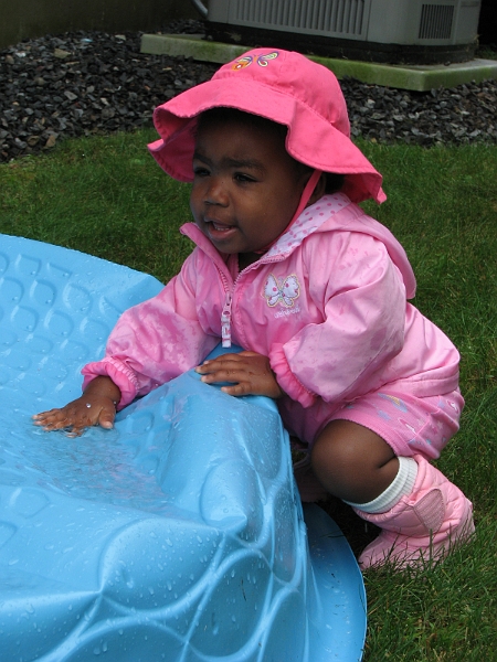Misc_2009_2010_124.JPG - Splashing in some rainwater on a neighbor's up-turned pool