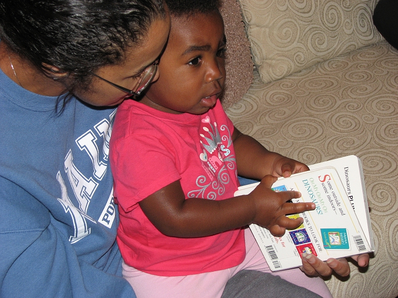 Misc_2009_2010_159.JPG - No Mommy, this is how you read the book...