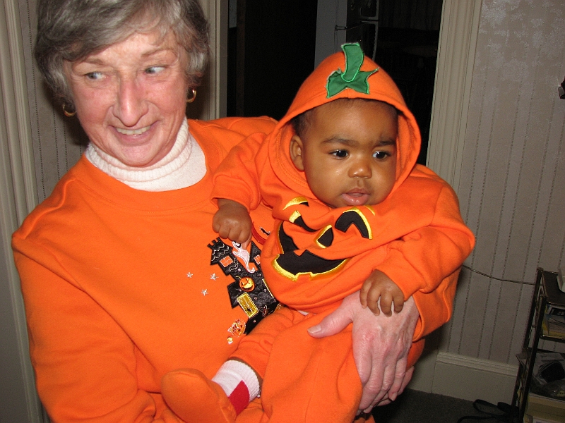 Halloween_Swim_066.JPG - A call on our neighbor Claire.  We also visited a few other neighbors before returning home.  Our bounty?  A box of animal crackers....Mikayla got to sample one, while her parents got to sample the rest. :-)